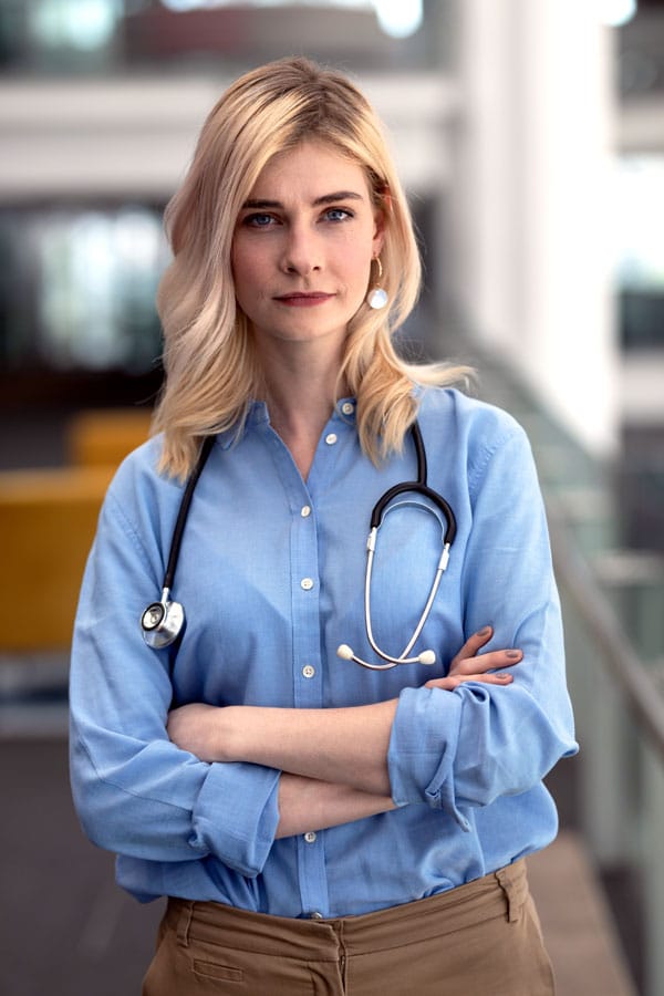 female consultant with arms crossed - specialist doctor